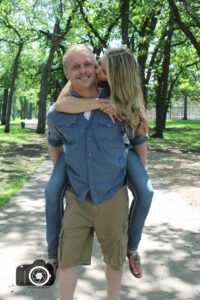an engagement photo piggy back ride